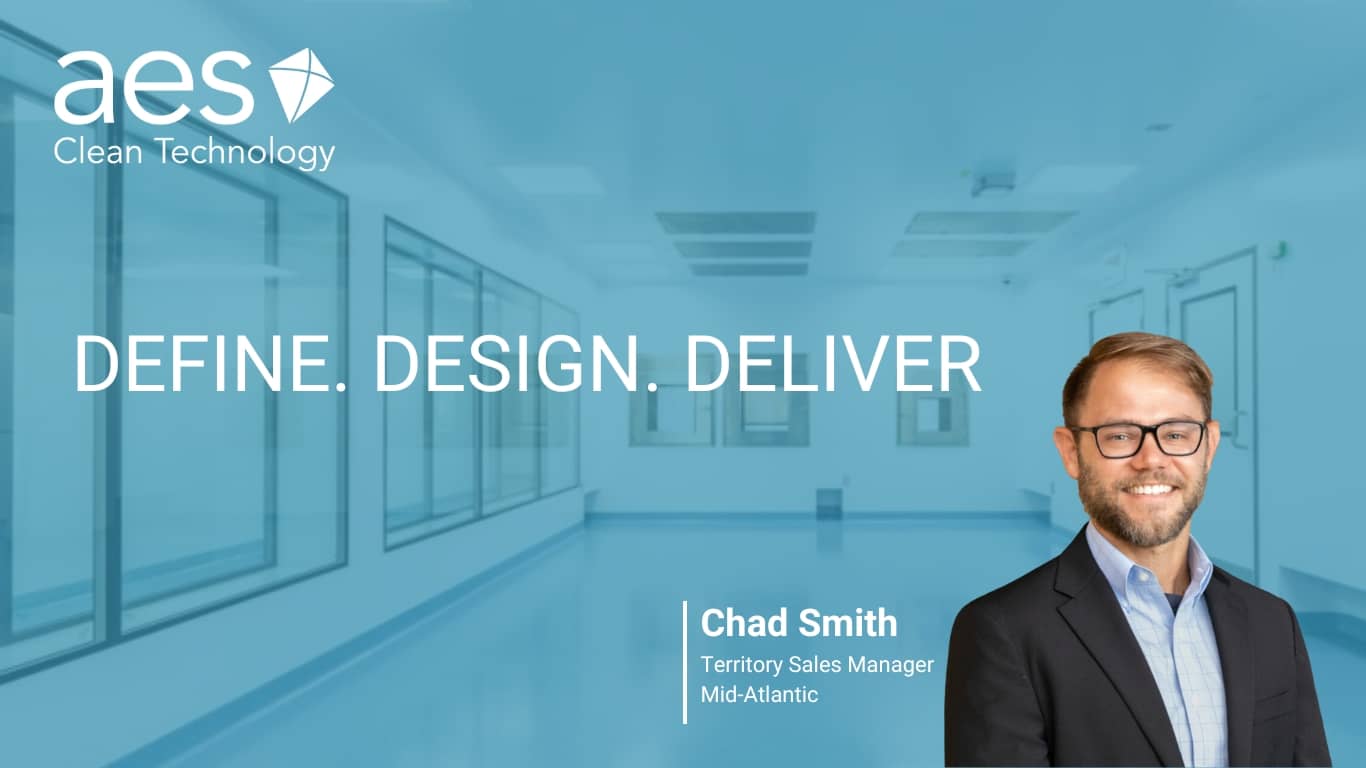 A headshot of modular cleanroom sales specialist Chad Smith in front of an AES pharmaceutical cleanroom